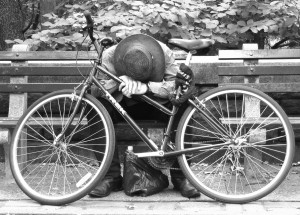 Man napping on bike